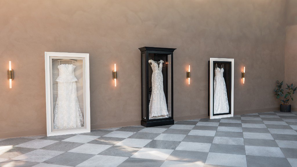 The Gallery and the Signature together: two wall-mounted cases flanking a freestanding case in a showroom